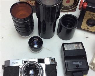 RICOH 500 35MM FILM CAMERA w RIKEN RIKOMAT LENS, COSMICAR/PENTAX KENKO 55MM LENS, E LUCKY #421546 LENS, SABRE CAMERA & FLASH, KODAK PROJECTOR ZOOM, AMBICO FLASH