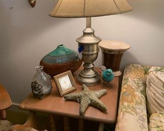 small end table, brass lamp and some home decor