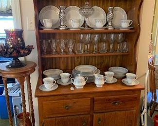 hutch with beautiful Noritake china and stemware