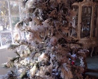 Flocked tree with all ornaments for one price. 4 available in different styles