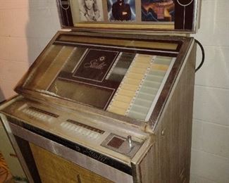 70's juke box works and loaded with 45's 