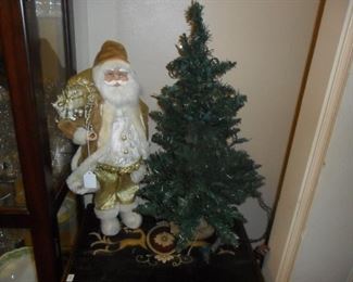 Santa and lit tree
