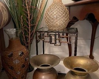 Antique spittoons, iron plant stand, wicker and glass vases