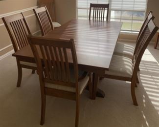 Table with 2 leaves 2 Captains chairs 4 Side Chairs.            Table 42” W 76” long(with 1 leaf in) Extra leaf 12”