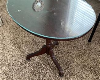Tilt top table with glass on top