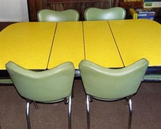Mid-Century modern Chrome Craft style kitchen tables & chairs. Lemon color table top, 6 avocado color chairs, 2 extra leaves, great shape - 1 leaf is missing chrome trim