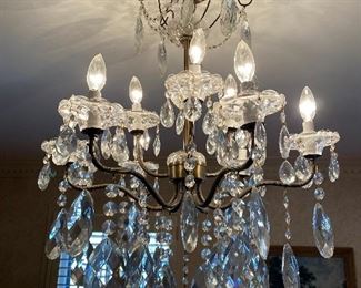 One of 2 matching chandeliers. Other is not hanging and not assembled