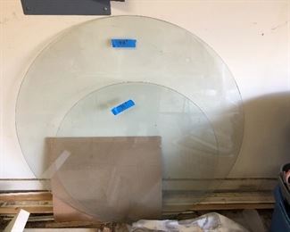 Two round glass table tops. One is 36” and the other is 48”.