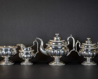 Lovely 4 piece coin silver tea set. Pieces are monogrammed CAL, and each piece is hallmarked G. EOFF in a cartouche. Garrett Eoff( b 1779- d 1845) was active in New York. Hand chased, floral band embossing around the finials and top edge of the creamer, egg and dart embossing on other edges, " whale mouth" spout on teapot. Tea pot measures 9 1/2 inches in height, the covered sugar measures 8 inches in height, waste bowl measures 5 inches in height and the creamer measures 7 1/2 inches (to tip of handle) in height. Total weight of this set is 78.51 troy ounces.
