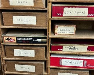 Well organized parts and pieces in vintage cigar boxes
