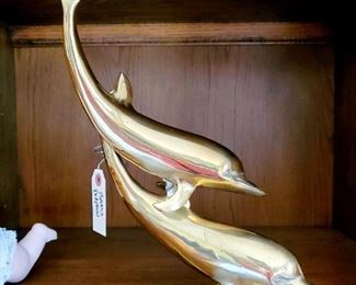 Brass dolphin sculpture
