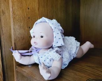 Porcelain crawling baby doll