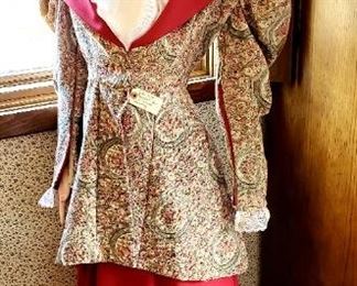 Life-size painted Victorian doll dressed in time. Appropriate clothing. Hand-painted porcelain. Stands roughly 5 ft tall
