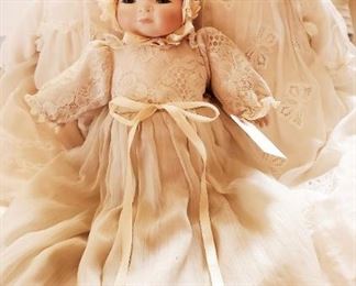Porcelain baby dolls dressed in Victorian lace linen. Priced separately
