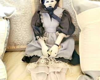 Porcelain Blue China doll. Has broken thumb