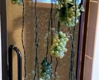 Three strands of rubber grape string lights.each Strand sold separately