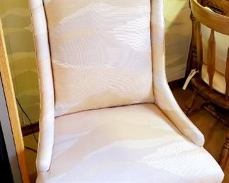 Pastel upholster colored high-backed chair