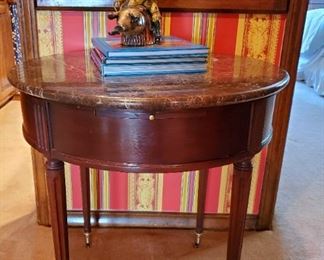 Wooden two drawer marble top. Side table on brass Wheels