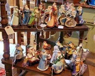 Three tier round shelf unit. Thomas Kinkade ornaments