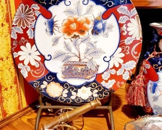 Imari decorative plate and cast iron stand