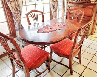 Wooden table with leaf. For we backed upholstered chairs. Table and chairs price separately. All chairs priced individually