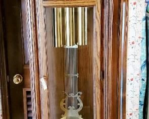 Colonial grandfather clock. Currently non-operational. In excellent condition
