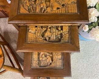 Stacking tables (4) with carved Asian motif.