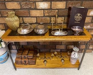 Sofa/long table; brassware; silverplate.