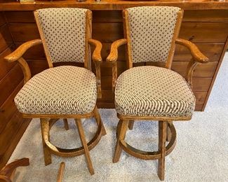 Two bar-height swivel stools.