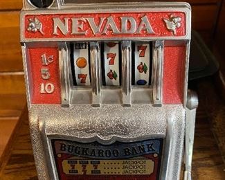Vintage Nevada Buckaroo Bank/slot machine.