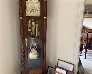 Trend grandfather clock with burl wood features.