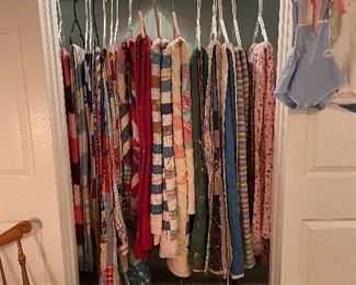 Closet packed full of vintage quilts and maple Windsor rocker