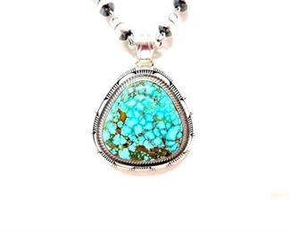 #602 • Native America Red Webb Kingman Turquoise And Engraved Sterling Silver Pendant By G Nelson, 60.96: G. NELSON REDWEB KINGMAN TURQUOISE. Very Classy Statement Piece. 
Weighs approx. 60.9g
Measures approx. 2" × 2.5"
PENDENT ONLY BEADS NOT INCLUDED