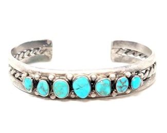 #614 • Vintage Navajo Native American Sterling Silver Turquoise Coiled Cuff: This beautiful vintage navajo cuff has seven engraved turquoise stones with accent sterling silver beads! Weighs Approx 29.3g Approx Size Cuff 2.5" Approx Width 2"
