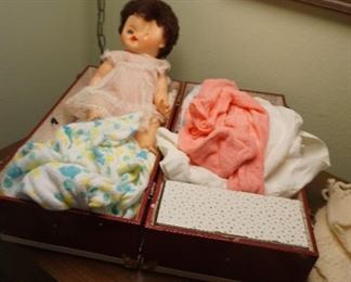 doll with clothes and trunk