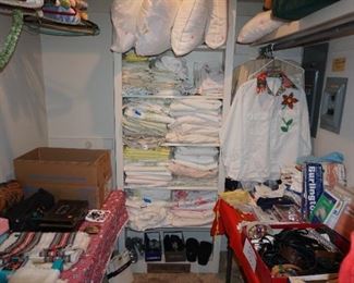 master closet #1 sheets, clothing, pillows, household