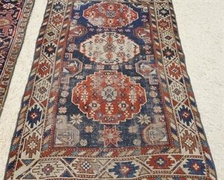 1027	ORIENTAL THROW RUG 3 FT 7 IN X 5 FT 6 IN HAS WEAR & A HOLE. 
