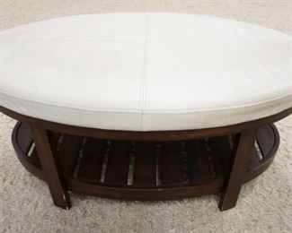 1048	UPHOLSTERED STOOL/BENCH W/ A BOTTOM SHELF. 44 IN X 27 IN, 19 IN H 
