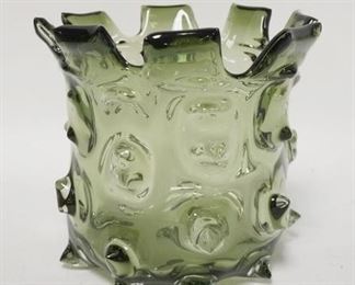 1075	GREEN BLOWN GLASS VASE W/ PULLED OUT HOBNAILS CHIP ON THE LOWER PROTRUSION . 7 1/4 IN H 
