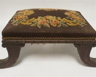 1086	CARVED UPHOLSTERED STOOL W/ BRASS CLAW FEET. 24 1/4 IN X 11 1 /4 IN AT THE SPLAYED FEET
