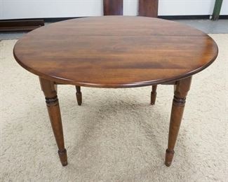 1143	NICHOLS & STONE 40 IN ROUND DINING TABLE, HAS SHELF CARVED SKIRT & 2-16 IN LEAVES
