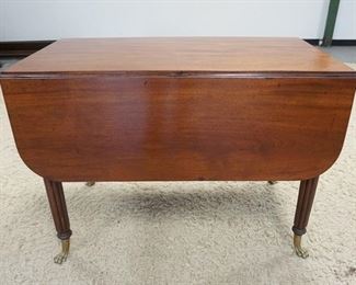 1154	MAHOGANY DROP LEAF TABLE W/BRASS CLAW FEET & FLUTED LEGS, 42 IN X 24 1/2 IN CLOSED, DROPS ARE 14 1/4 IN, 30 1/4 IN HIGH
