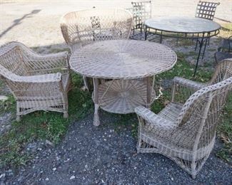 1164	WICKER TABLE & 3 CHAIRS, TABLE DIAMETER IS 42 IN
