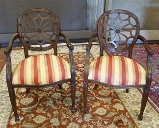 1195	PAIR OF CARVED WHEEL BACK ARM CHAIRS, SOME STAINING & WEAR TO THE SEATS
