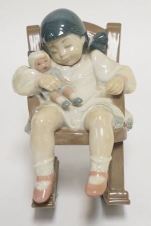 1239	LLADRO GIRL W/ DOLL IN ROCKING CHAIR 5 IN H 
