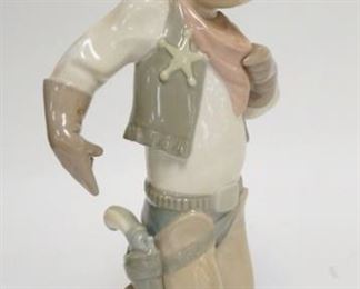 1244	LLADRO YOUNG COWBOY W/ SHERRIFS STAR 10 3/4 IN H 
