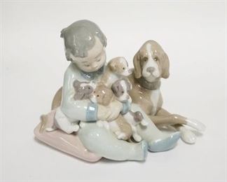1248	LLADRO CHILD W/DOG & PUPPIES IN HIS ARMS, 6 1/2 IN WIDE X 5 IN HIGH
