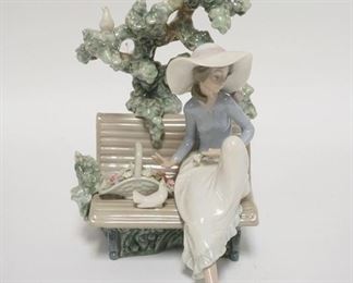 1250	LLADRO GIRL ON A PARK BENCH W/A BASKET OF FLOWERS, TREE BEHIND, 2 DOVES, 8 1/2 IN HIGH X 6 IN WIDE
