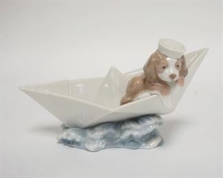 1253	LLADRO PUPPY IN A BOAT W/SAILING HAT, 6 3/4 IN WIDE X 4 IN HIGH
