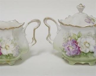 1261	SIGNED RS PRUSSIA CREAMER & COVERED SUGAR, SUGAR IS 4 7/8 IN HIGH

